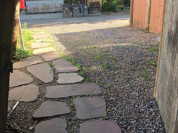Path from our front house to Carriage House parking, alley, recycling