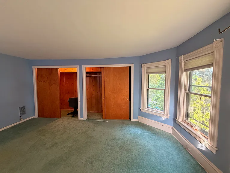 Upstairs side bedroom, showing closets.