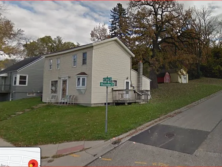 Large corner lot with off-street parking and one car detached garage