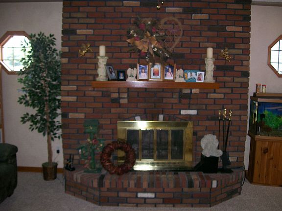 Living room with additional sunken living room with fireplace.