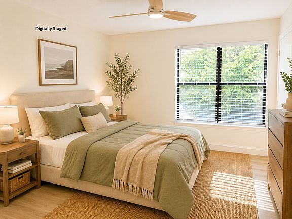 Master bedroom with walk in closet and a private bathroom. Digitally Staged