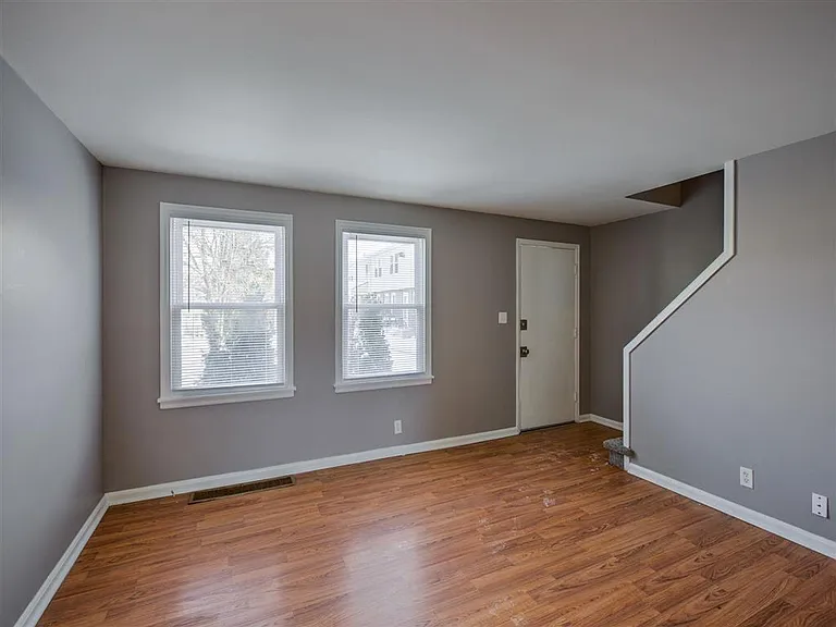 Living room and front entrance to a unit at Colonial Park.