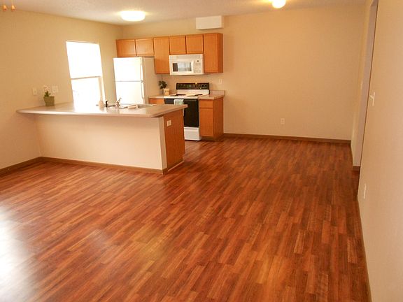 Living room viewing kitchen and dining area
