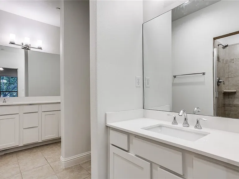 Spacious master bath features dual vanities and plenty of cabinet space in the newly updated vanities.