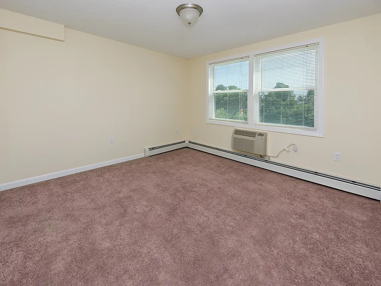 bedroom one, view standing in door way, closet on wall to the left