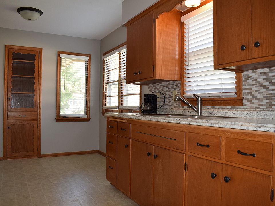 Dishwasher to be installed in cabinetry on right. New pendant light to be installed above sink