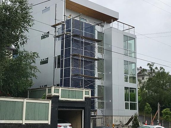 Exterior with solar panels and green wall