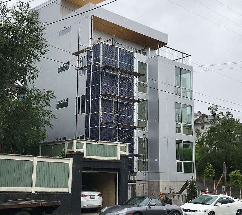 Exterior with solar panels and green wall