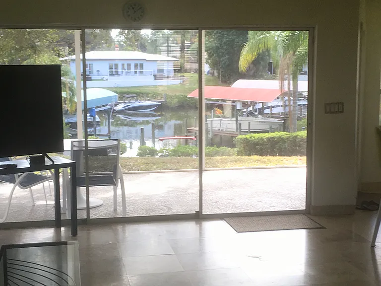 Sliding door to lania overlooking back yard