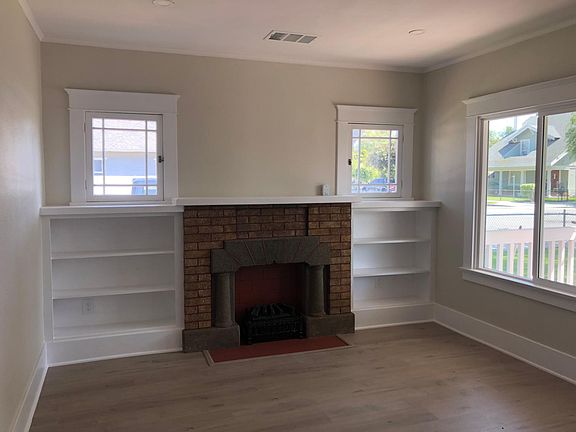Living room with fireplace, vinyl plank flooring