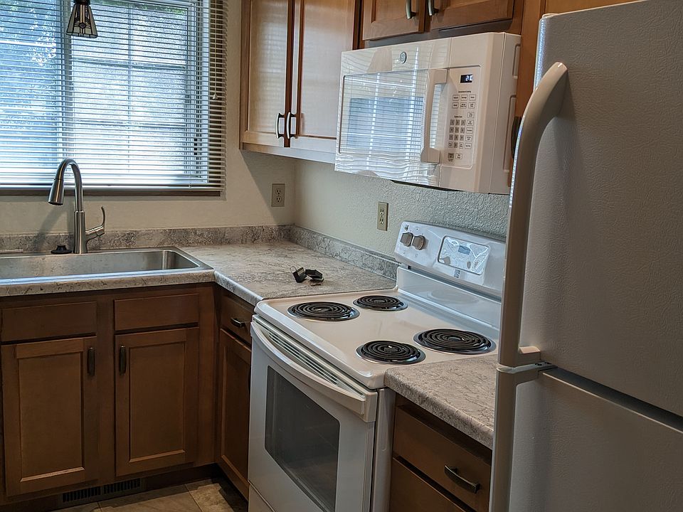 Previously rehab'd kitchen. It will look very similar to this layout but be just a slightly different color. There is no kitchen window in this unit.