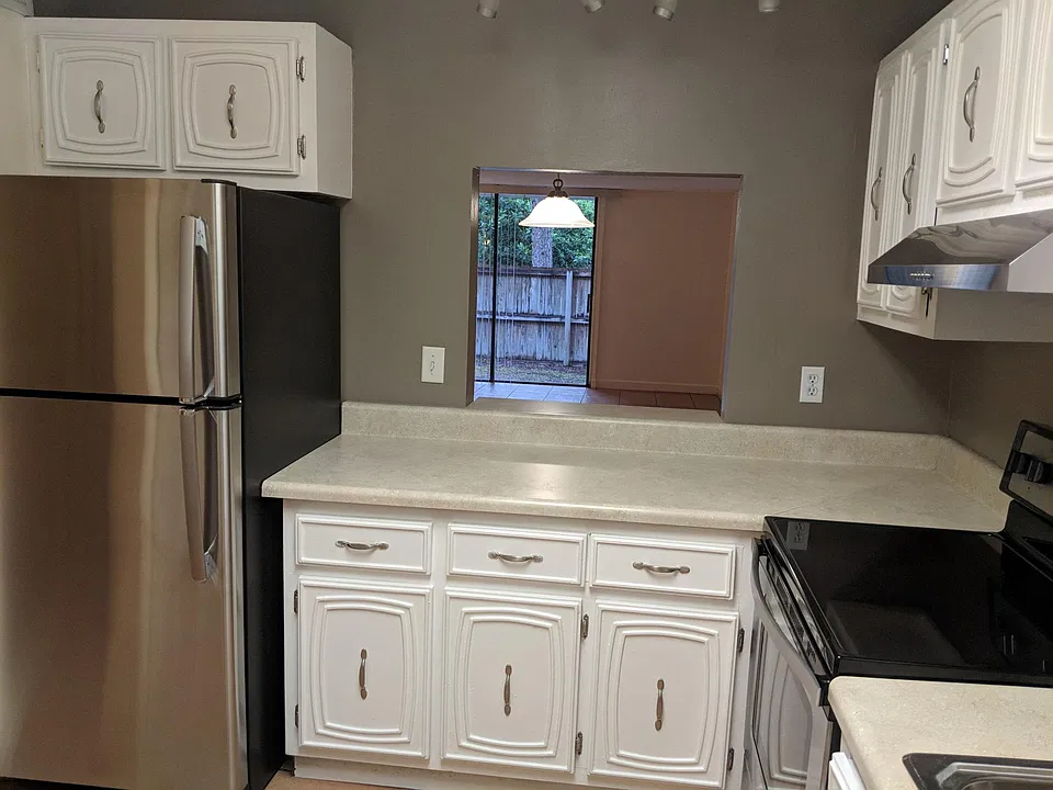 Kitchen with view through to back patio