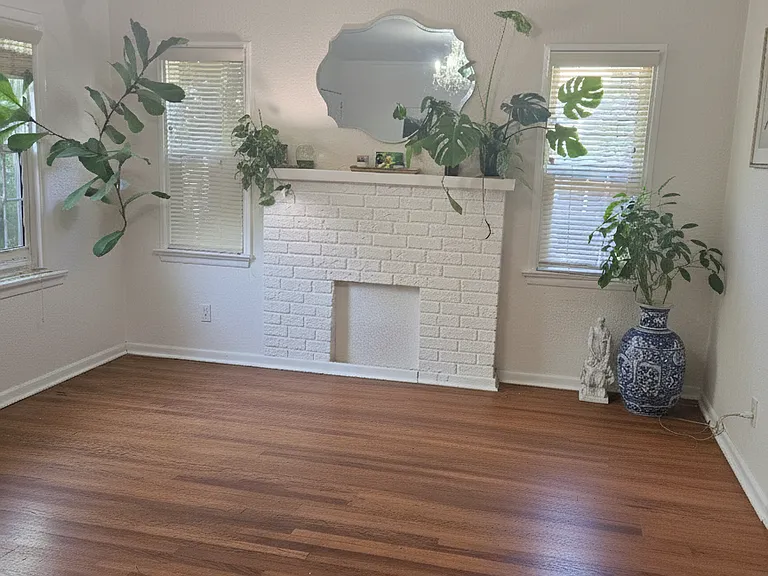 Large, filled with light and windows, includes chandellier, wood floors and flow through to the dining room