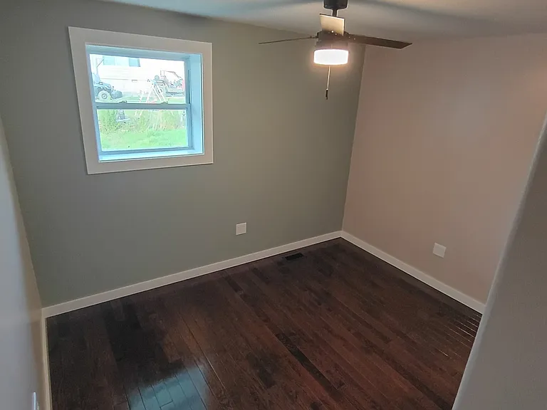 bedroom2 with hardwood floors new fan and windows large closet for all your closet needs