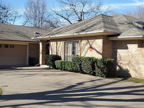 Front of house with circle driveway