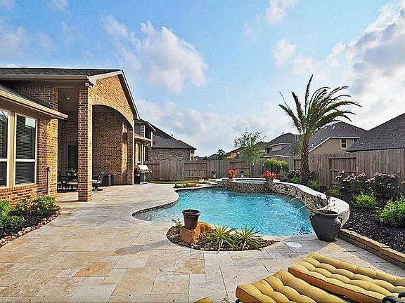  Vacation at home!  Relax and unwind with the beautiful lush landscaping.
