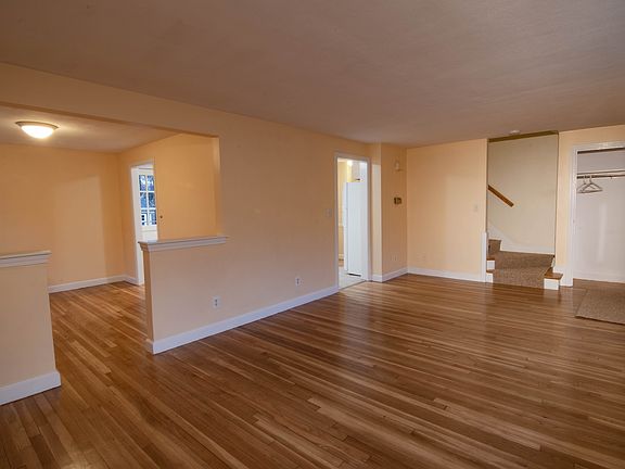Living room with view of dining room