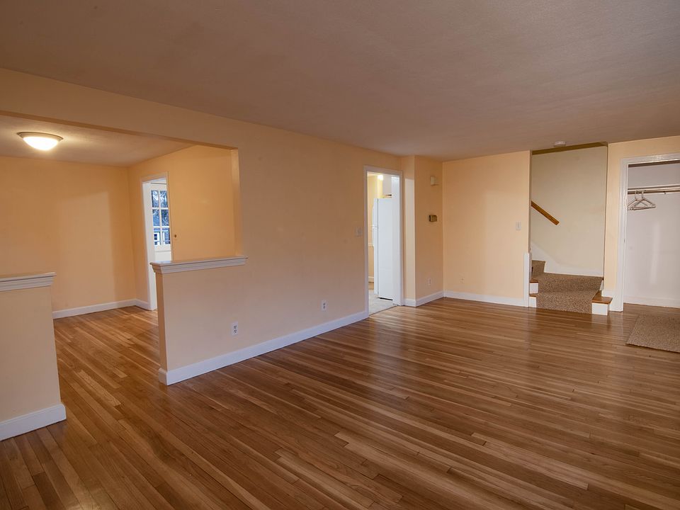 Living room with view of dining room