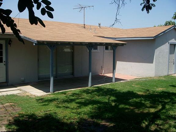 Back yard looking towards covered patio