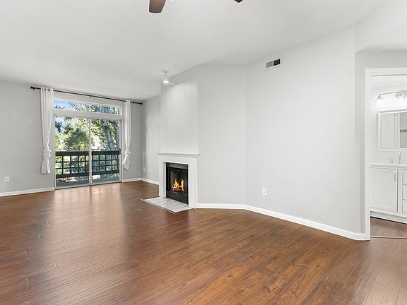 Open living area with private balcony access, and a full bathroom conveniently located nearby.