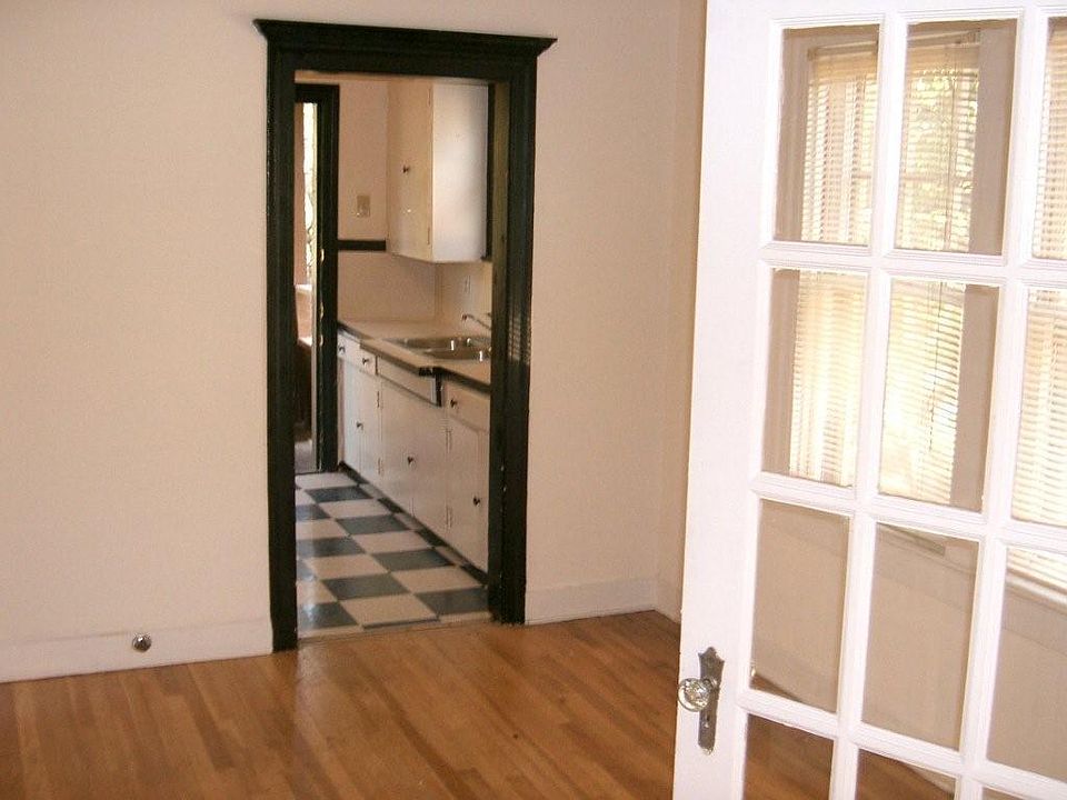 French doors in dining area looking into kitchen,.