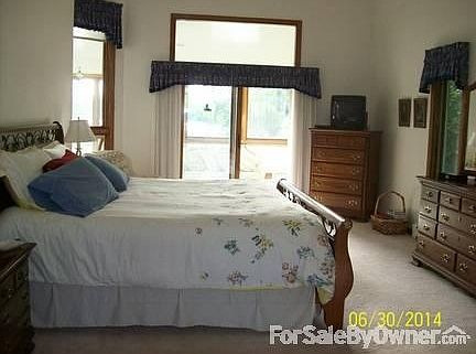 Master bedroom
						:
						Patio doors open to three season room. Picture taken from area to master bath.