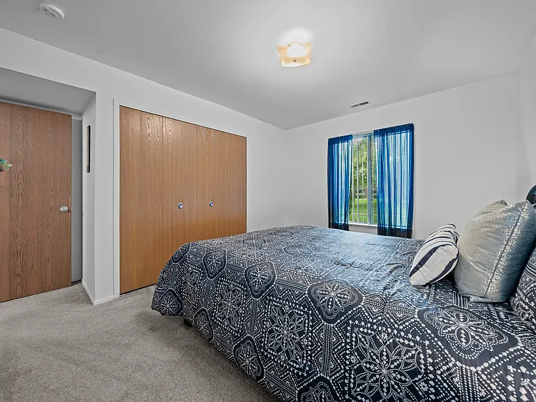 Spacious bedroom at Westwood Village Apartments in Westland, MI