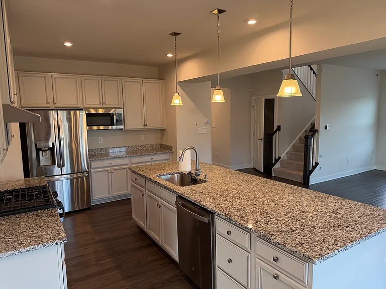 Massive Open Concept island, sink, dish washer, in sink disposal, and multi-person eat in bar seating