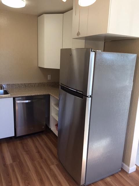 Kitchen with stainless steel appliances and granite counter