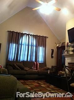 Living room
						:
						Open floor plan. High ceilings, wood floors through out entire home.