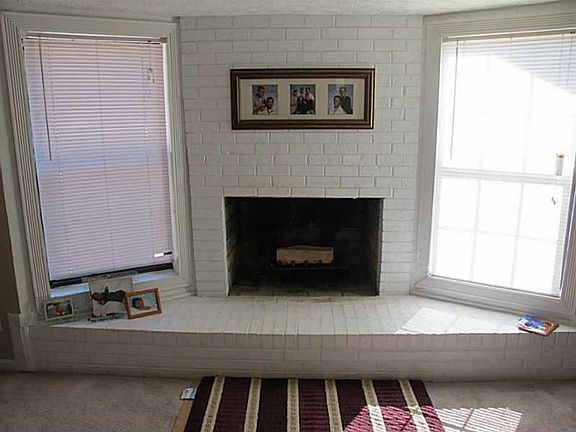 Living room fireplace (before floors were replaced).