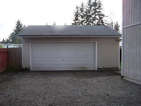 Oversized 2+car man cave has its own power with 220amp. Heated, carpeting &insulated additional work