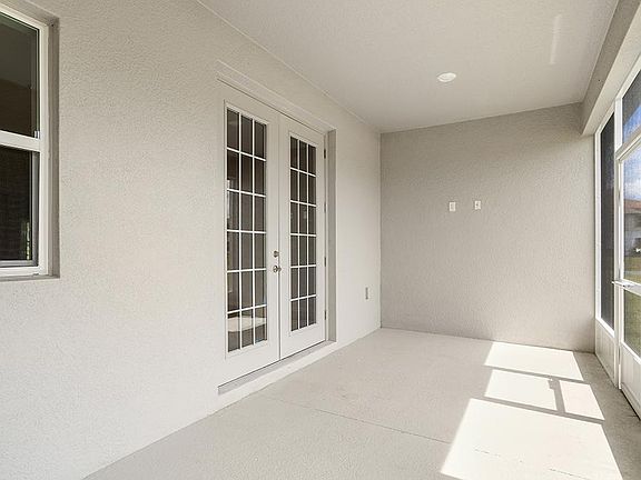 Your interior opens to outdoor living space on a large covered lanai - Willow II with Loft by Highla