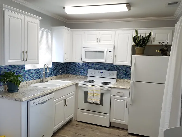 New cabinets, sink, faucet, light, back splash and more.