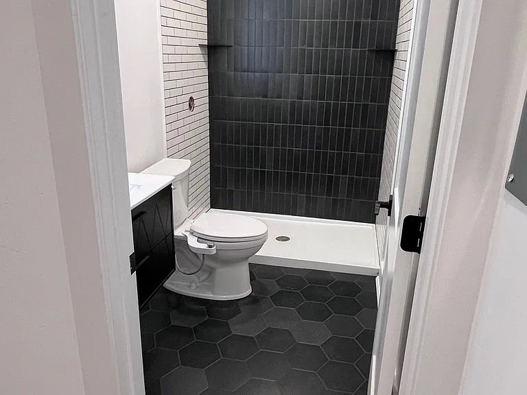 Designer finishes: modern floating bathroom vanities, custom tile shower surrounds and flooring, and high end finishes are featured in each spacious bathroom.