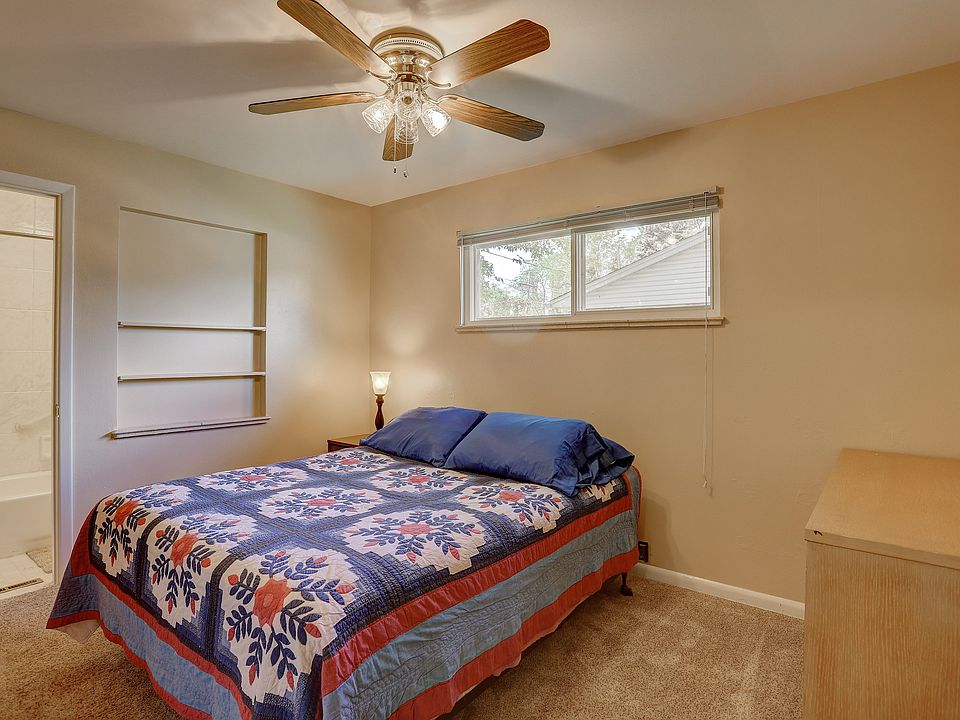 Private bedroom with ceiling fan.