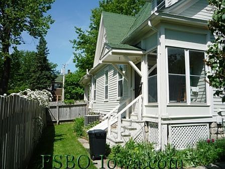 Back of house w/ porch and yard. The yard continues behind you not quite as far but much wider. Pict