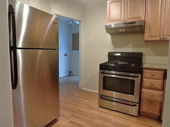Kitchen with Stainless Steel Fridge and Oven