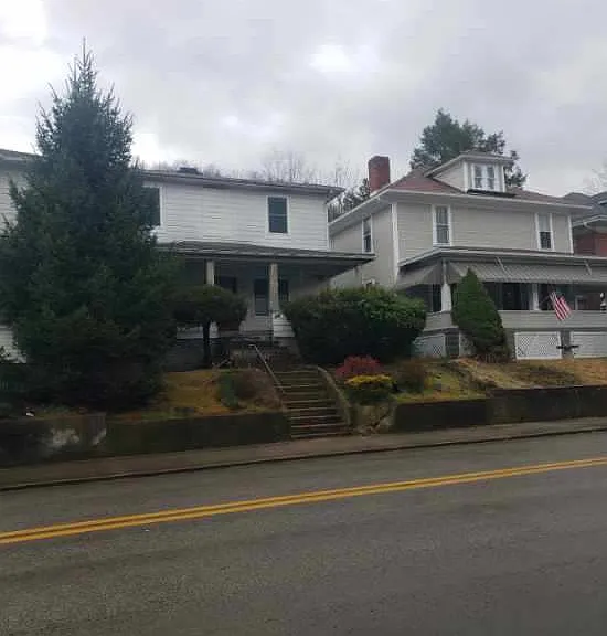 Front of house. Entrance, parking and deck for 411B are in the back.