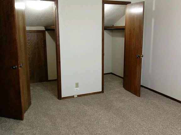 Looking at two closets in large upstairs bedroom