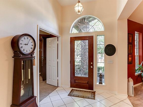 Beautiful glass door and tiled entry.