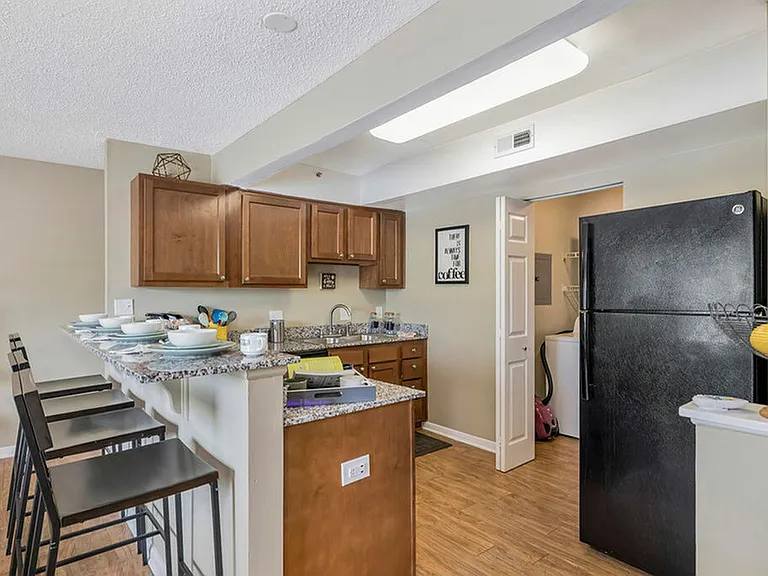Modern Style with Granite Counters and Black Appliances