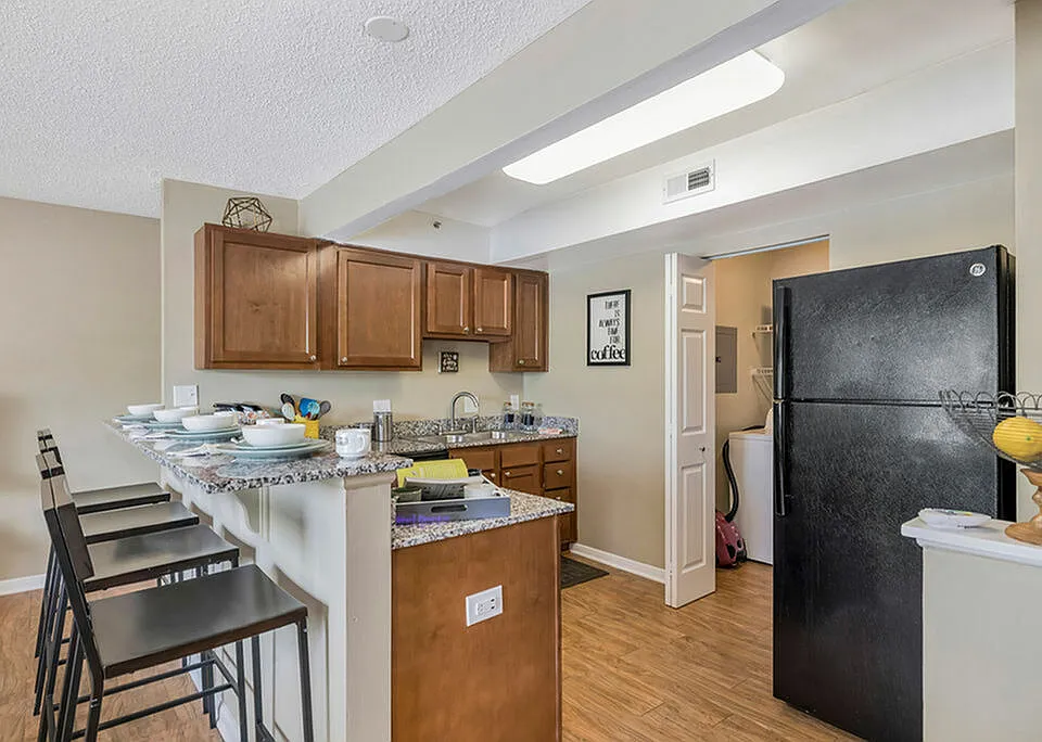 Modern Style with Granite Counters and Black Appliances