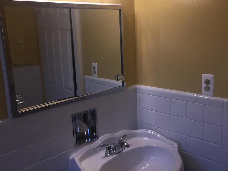 Full bathroom (note the walls have been painted white)