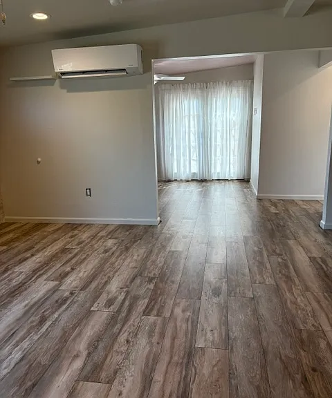 Light comes in from covered deck that is accessible by French doors in the bedroom.