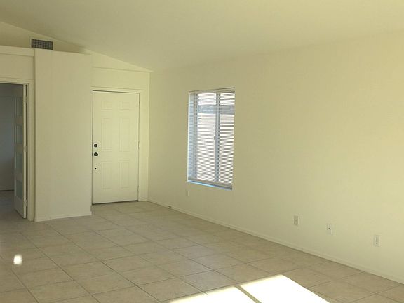 Entrance to living room with vaulted ceilings