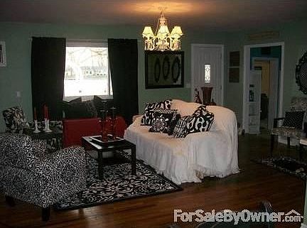 Living room w/original hardwood floors : Large picture window overlooking the water
