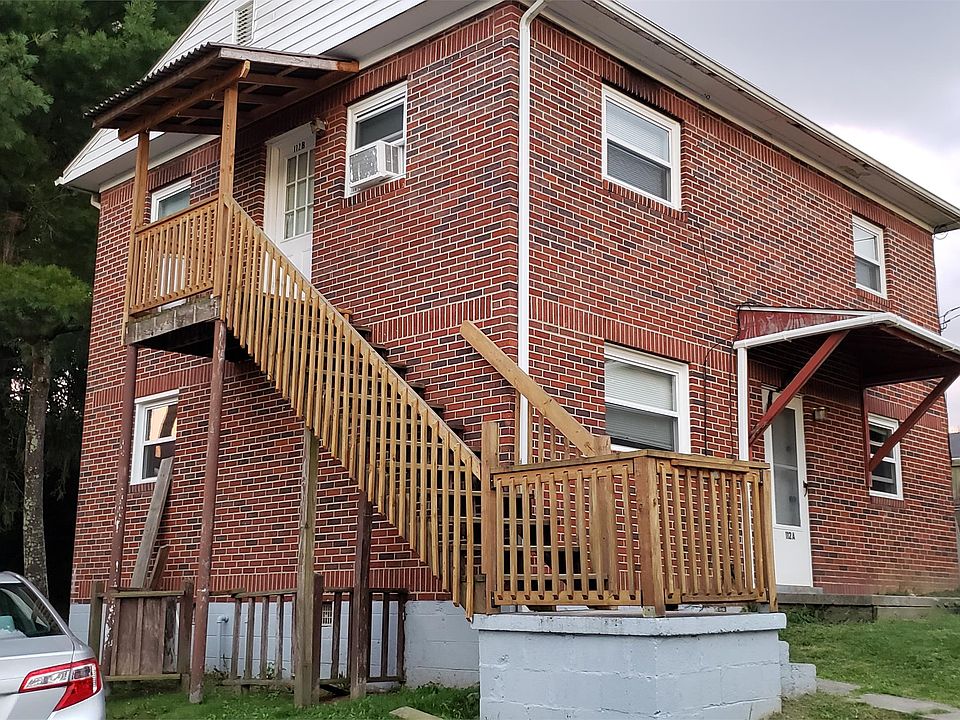 The door to this apartment is up the stairs to the left of the building.