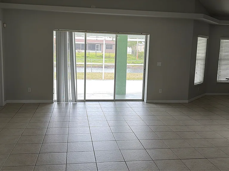Family room view out to patio/canal