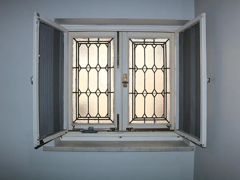 Stained glass window in the office. Notice the granite shelf!